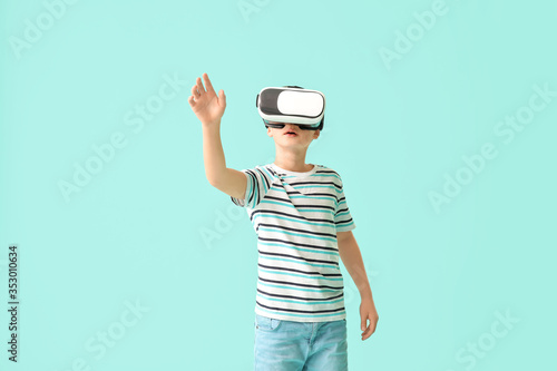 Cute little boy with VR gla...