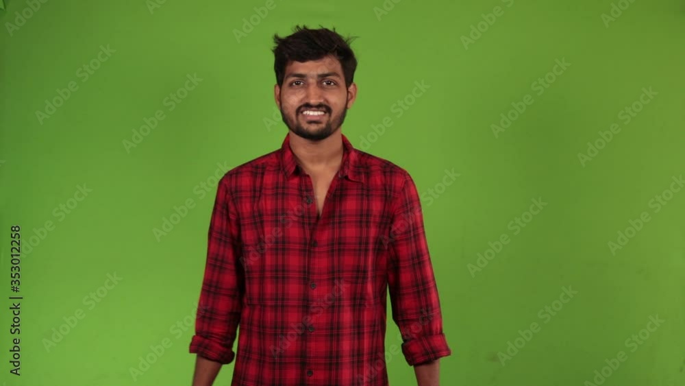 Cheerful Indian guy giving two thumbs up. Handsome asian businessman gesturing thumbs up with hands. Green Chroma Key backgro Cheerful Indian guy giving two thumbs up. Handsome asian businessman gesturing thumbs up with hands. Green Chroma Key backgro