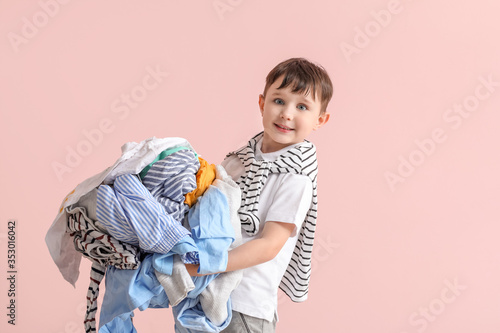 Little boy with laundry on ...
