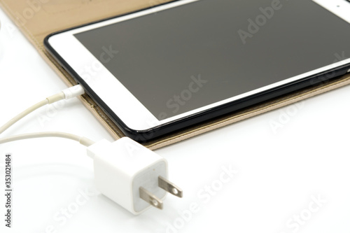 Tablet PC with brown case with transformer On white backdrop