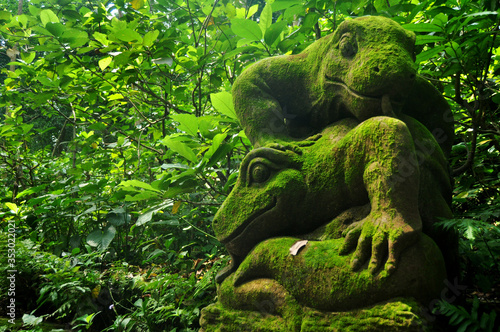 Art sculpture and carved antique deity angel god of hindu statue balinese style in Mandala Suci Wenara Wana or Ubud Sacred Monkey Forest Sanctuary at Ubud city in Bali, Indonesia © tuayai