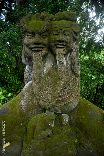Art sculpture and carved antique deity angel god of hindu statue balinese style in Mandala Suci Wenara Wana or Ubud Sacred Monkey Forest Sanctuary at Ubud city in Bali, Indonesia © tuayai