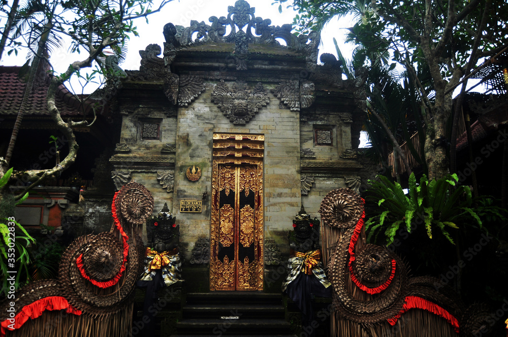 Art sculpture and carved antique deity angel god of hindu statue balinese style in Ubud Palace or Puri Saren Agung historical building complex situated at Gianyar Regency in Bali, Indonesia