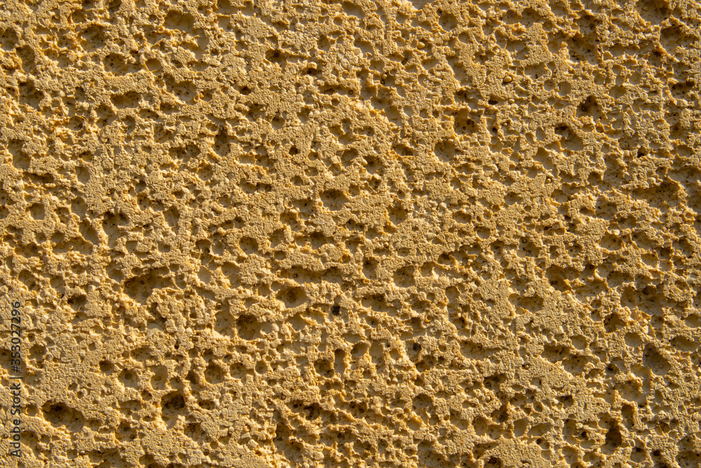 texture of yellow porous stone with shadows texture of yellow porous stone with shadows