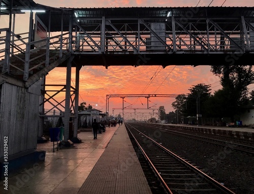 Indian Railway Station Platform against Dramatic Sunset