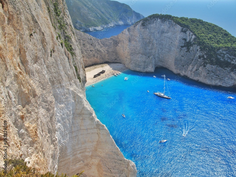 Fototapeta premium Beautiful panoramic view from the rock to the famous Navagio Ship Wreck, Zakyntos island, Greece.