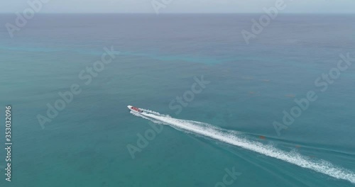 Wallpaper Mural Speedboat sailing in turquoise waters, Dominican Republic. Aerial view Torontodigital.ca