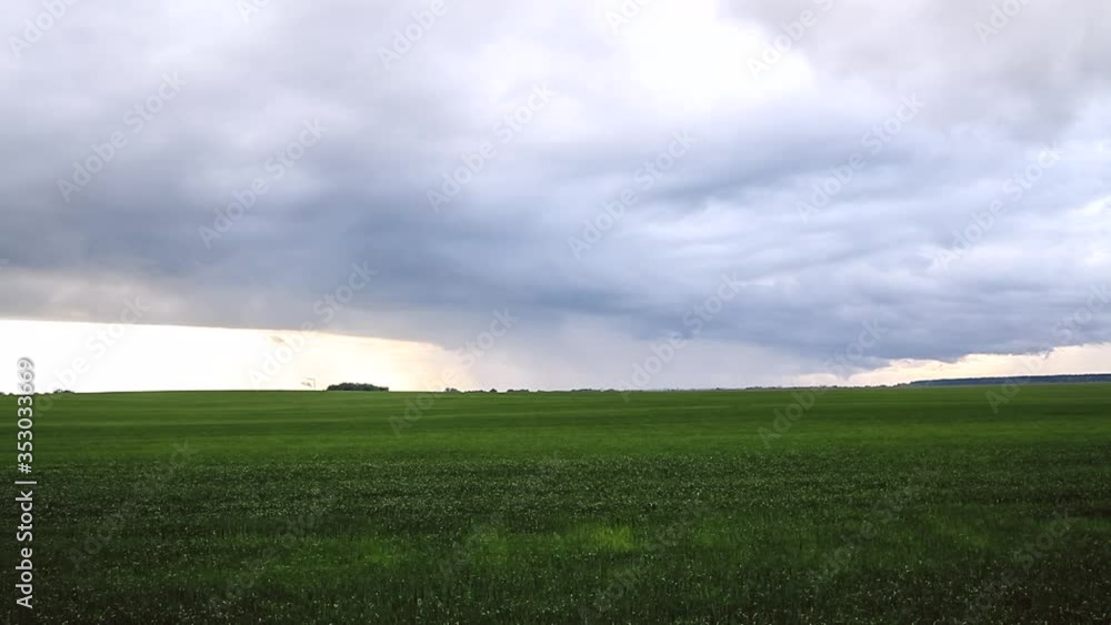 The rapid movement of the rain cloud during the rain. Rain cloud over the field. Timelapse video of sky before the rain. The rapid movement of the rain cloud during the rain. Rain cloud over the field. Timelapse video of sky before the rain.