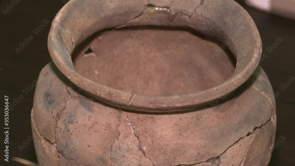 clay pot glued from pieces. clay jug. Fragments of ancient ceramics.
