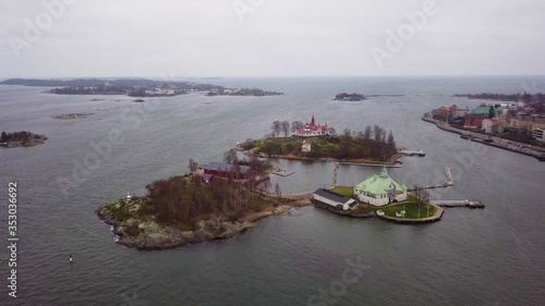 Aerial View of Valkosaari and Luoto Islands With Buildings on the Helsinki South Harbor in Finland on a Cloudy Day photo