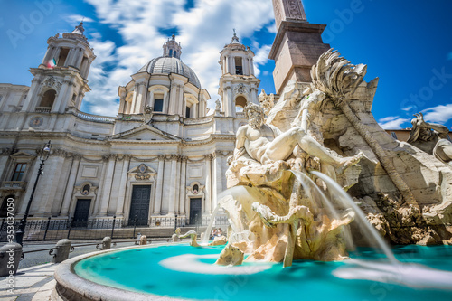 Fountain of rivers in Rome in Italy. In the background, the baroque church of Santa Agnese in Agone. photo