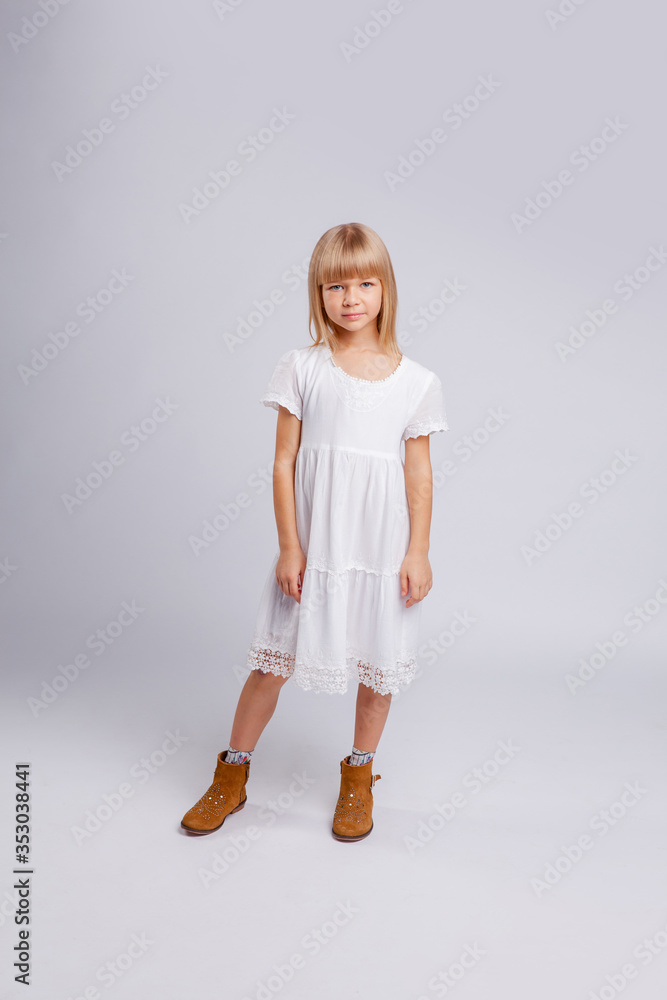 girl in a white dress stands in full growth girl in a white dress stands in full growth