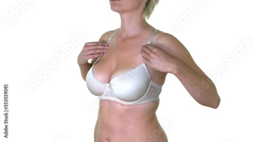 Sensual woman with big size breastcorrect her lifting bra.