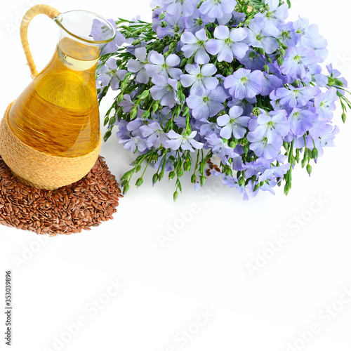 Linseed oil, flaxseed and flowers isolated on a white . Free space for text.