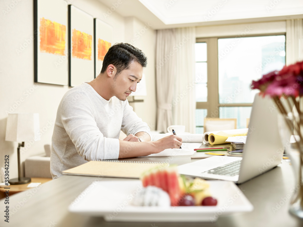 young asian man designer working from home young asian man designer working from home