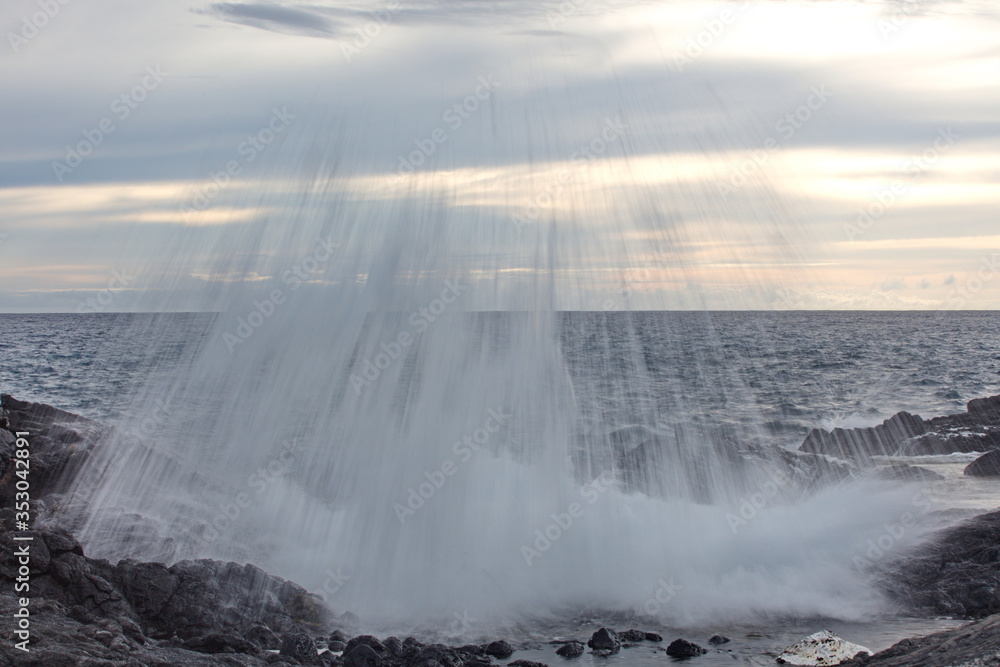 Ocean falls at sunset