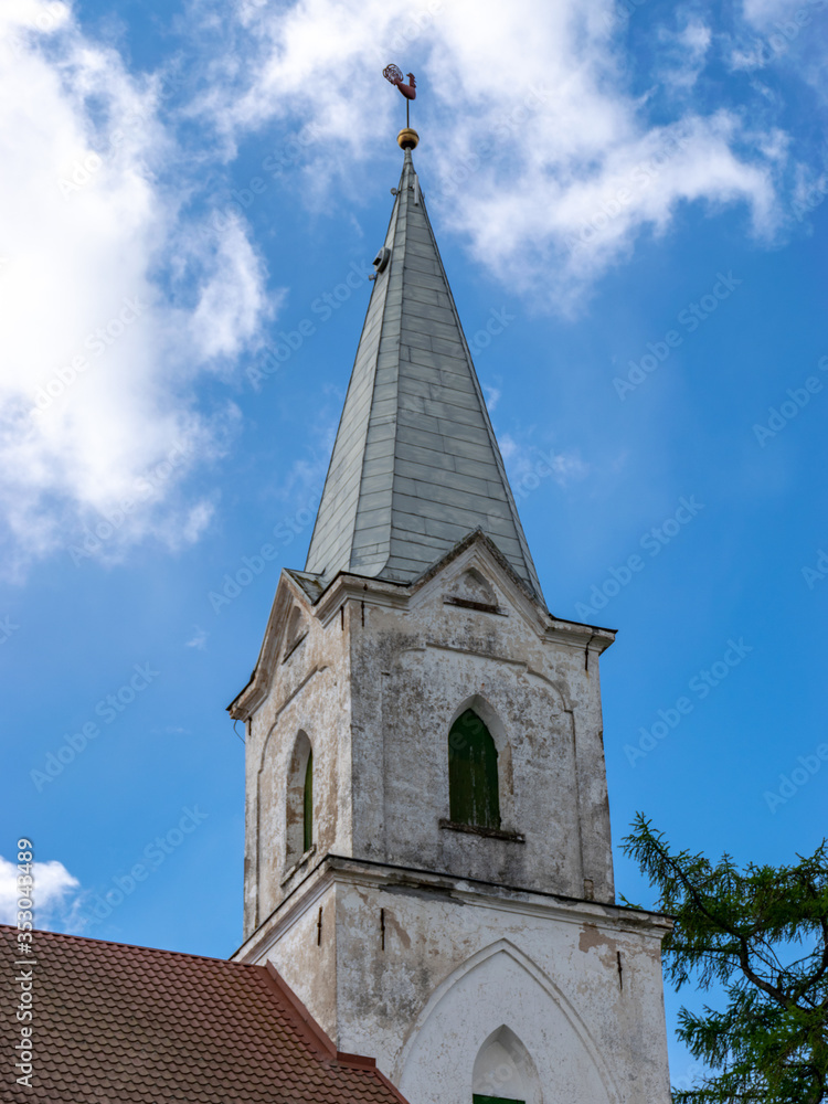a white Lutheran church tower against the sky
