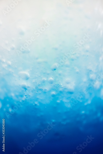 Blur image for the background of Blue Soda In the photo, the soda is still on the top of the glass to mix with the blue syrup on the bottom of the glass.