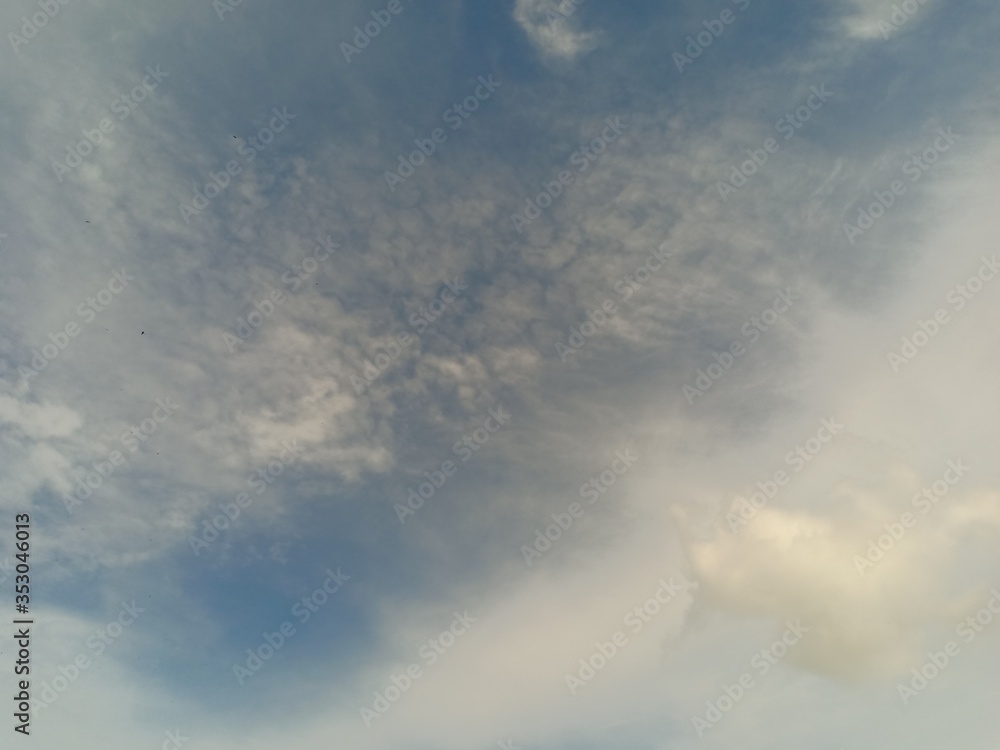 black and white clouds with blue sky