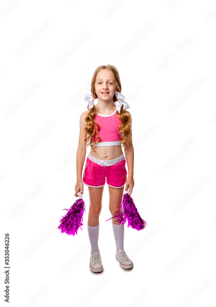 cute girl in pink cheerleader clothes dancing with shiny pompons in her hands cute girl in pink cheerleader clothes dancing with shiny pompons in her hands