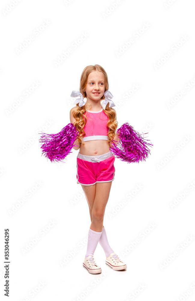 cute long-haired girl in a pink top and cheerleader clothes dancing with pompons cute long-haired girl in a pink top and cheerleader clothes dancing with pompons
