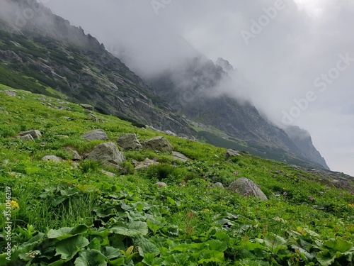 Mountain landscape with clouds and fog