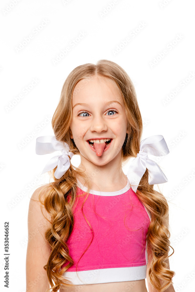 funny girl in a pink top shows tongue and makes funny faces funny girl in a pink top shows tongue and makes funny faces