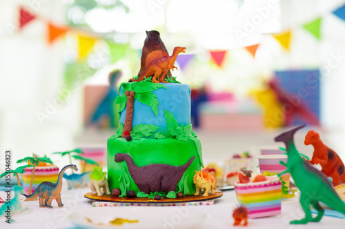 Kids birthday party. Dinosaur theme cake. photo