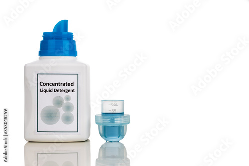 Tecnologically advanced compact concentrated laundry liquid detergent on white background