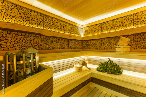 Foto modern beautiful sauna with brooms and sauna accessories, a dry steam room with