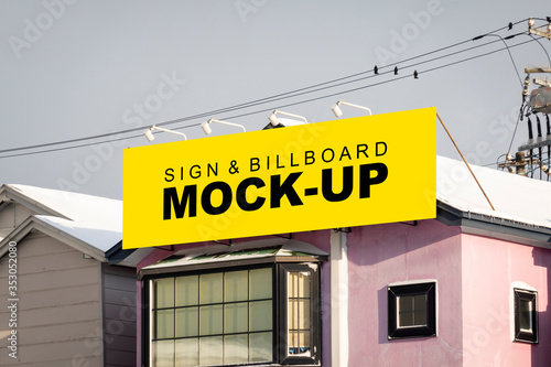 Mock up large outdoor billboard on the roofing of building