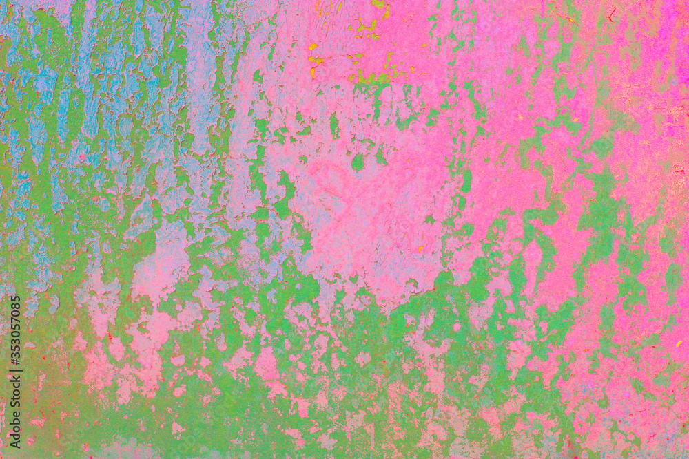 Rough green pink textured concrete wall.