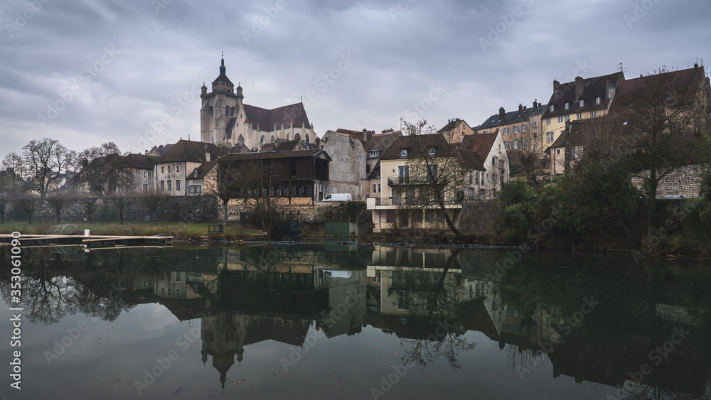Ancient French classic medieval town with river in front, travel in a cloudy day
