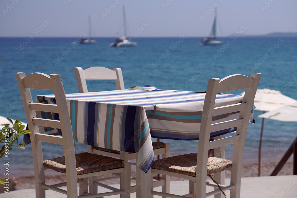 Table of a restaurant with a sea view in Finikounda
