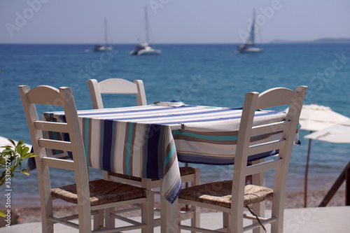 Table of a restaurant with a sea view in Finikounda © jekatarinka