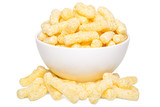 A heap of corn snacks. Sweet sticks of puffcorn. Dry breakfast in white bowl