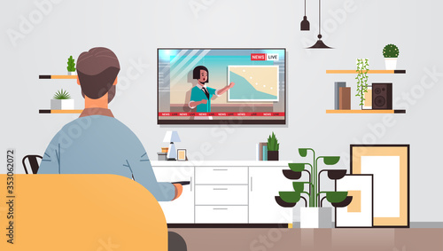 man watching TV daily news program on television guy using remote controller modern living room interior rear view horizontal vector illustration