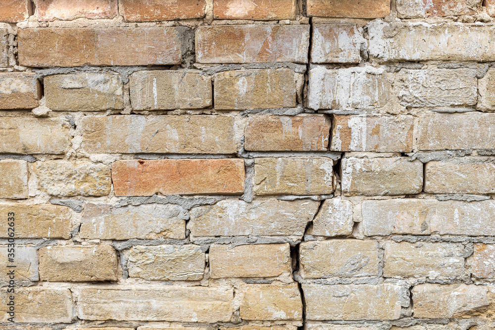 Brick wall with a crack background. Brick wall with a crack background.