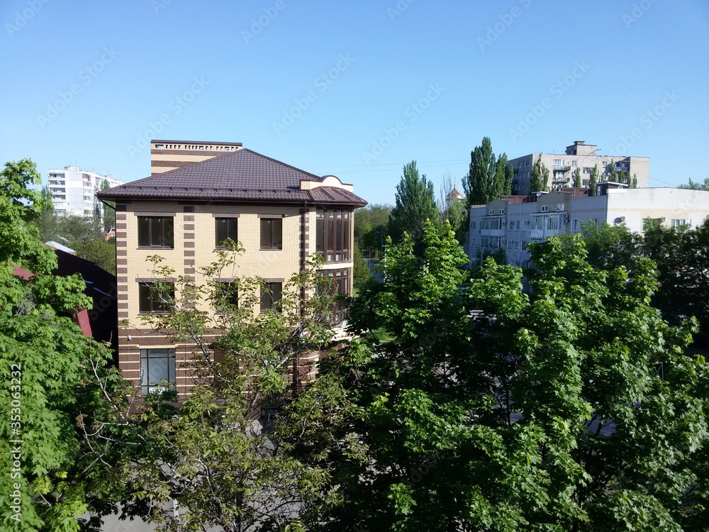 View from the balcony of a multi-storey building on the city houses