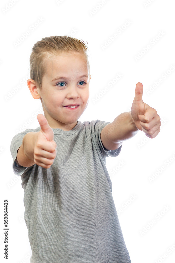 Young smiling caucasian boy shows thumbs up isolated on white background Young smiling caucasian boy shows thumbs up isolated on white background