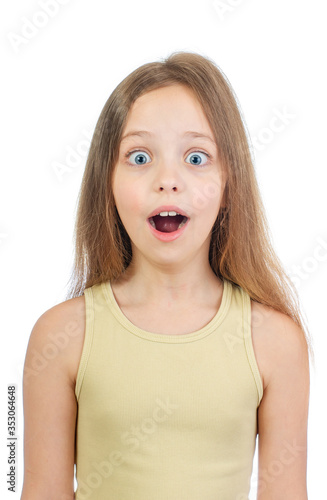 Young cute girl with grey blue eyes and long light brown hair surprised isolated on white background
