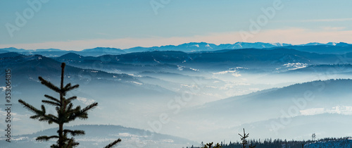 Fototapeta Naklejka Na Ścianę i Meble -  View to Nizke Tatry mountains in Slovakia from Magurka Wislanska hill in winter Beskid Slaski mountains in Poland