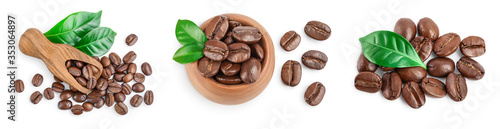 Heap of roasted coffee beans with leaves isolated on white background . Set or collection