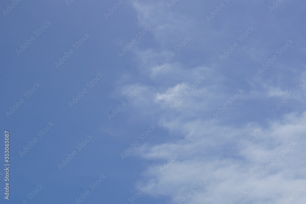 Fluffy white clouds in daytime  blue sky background