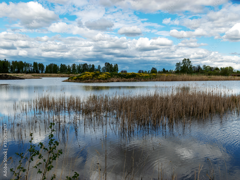 calm scene of beautiful sky with cumulus clouds reflection on the lake calm scene of beautiful sky with cumulus clouds reflection on the lake