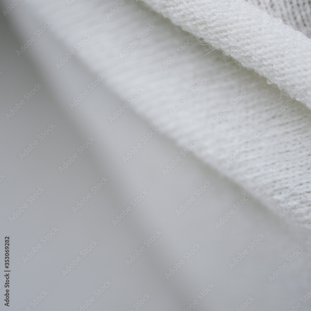 soft white plaid with a woolen texture. straight lines. close-up soft white plaid with a woolen texture. straight lines. close-up