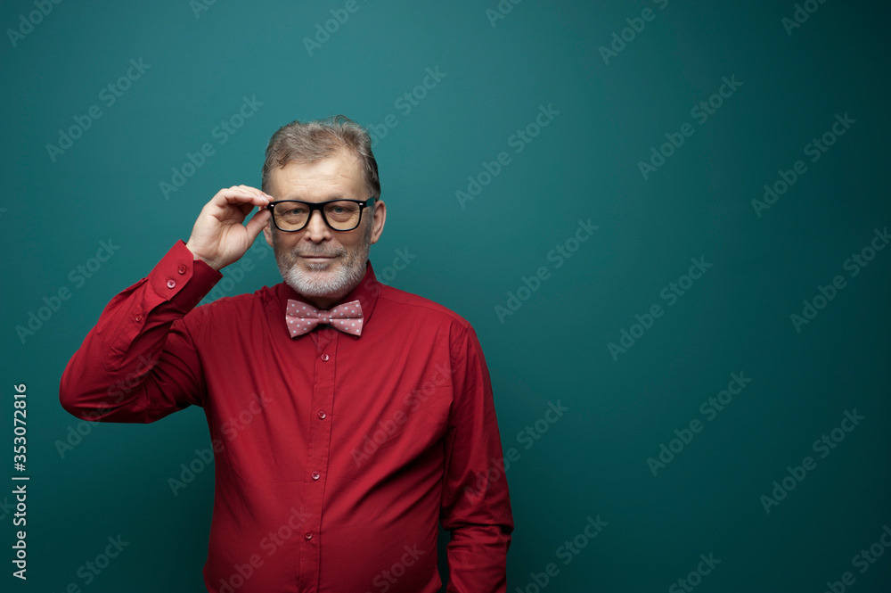 Portrait of a positive elderly man in glasses Portrait of a positive elderly man in glasses