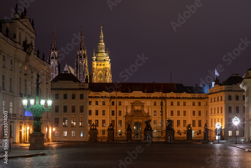 Main gate of the Prague Castle by night as seen from Hradcanske Namesti square.  © Jan