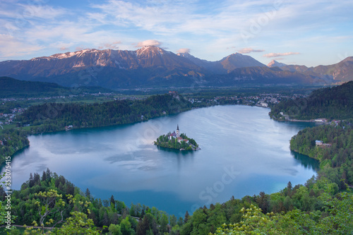 Aerial view of Lake Bled and Julian Alps  with lake island and charming little church dedicated to the Assumption of Mary  famous tourist attraction in Slovenia
