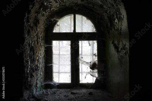 Window with spiderweb of old building